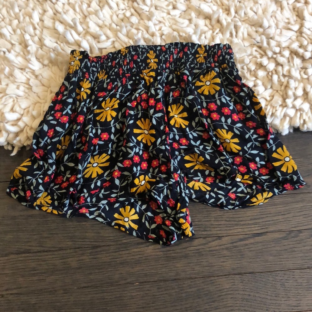 Out from under flowy floral shorts